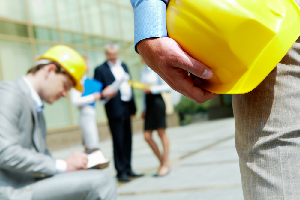 people in hard hats on construction site