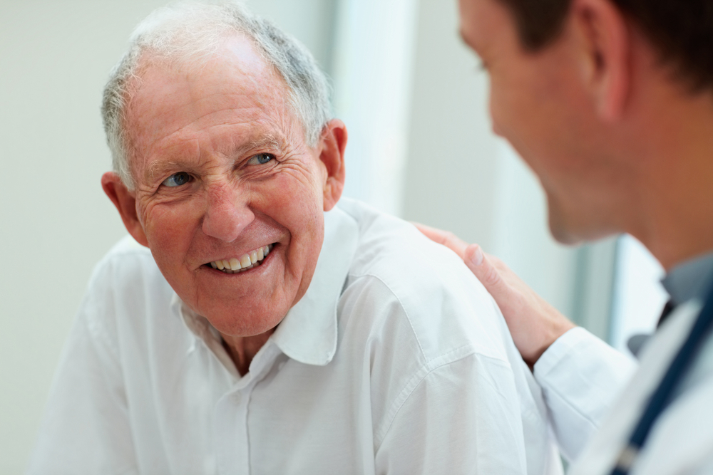 elderly man being reassured by mediator